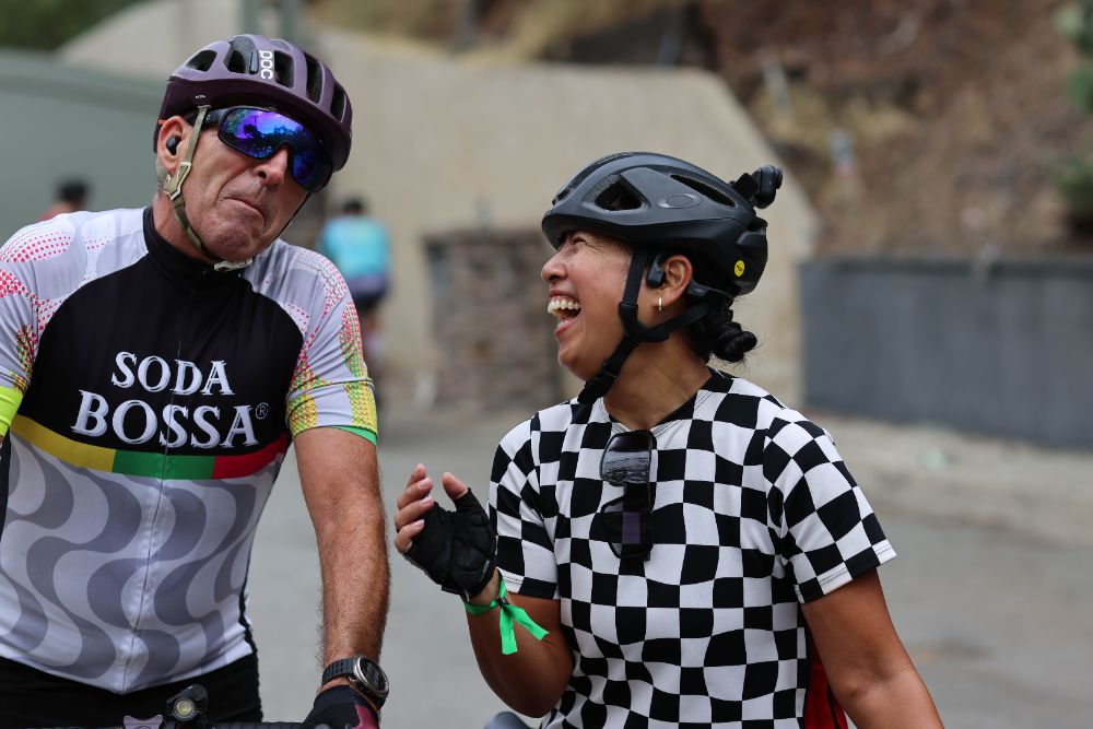 Two riders laughing between laps in Mandeville Canyon