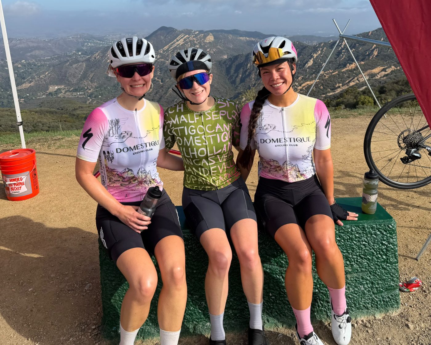Three DCC members in the 2026 kit at a mountain summit